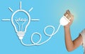 Hand drawing a light bulb Idea Royalty Free Stock Photo
