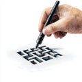 A hand drawing a maze with a black pen symbolizing creativity challenges and problemsolving in a visually engaging manner Royalty Free Stock Photo