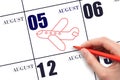 A hand drawing outline of airplane on calendar date 5 August. The date of flight on plane.