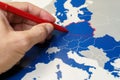 Hand drawing a red line between Poland and the rest of EU, Polexit concept. Royalty Free Stock Photo