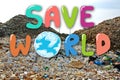 Hand drawing Save the World on garbage dump in landfill background. Environmental conservation and saving the earth concept