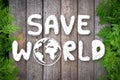 Hand drawing Save the World with wooden and green leaves nature background on Happy earth day. Environmental conservation Royalty Free Stock Photo