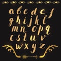 Hand drawn alphabet letters in gold