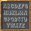 Hand drawn alphabet in white chalk style on a brown board with grid