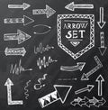 Hand drawn arrow icons set on black chalk board.