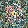 Hand drawn back to school banner with doodles and sketch style lettering and education icons, study symbols on Royalty Free Stock Photo