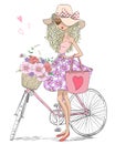 Hand drawn beautiful, cute girl stands near bicycle with a basket full of flowers. Royalty Free Stock Photo