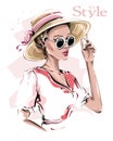 Hand drawn beautiful young woman in hat. Stylish girl in sunglasses. Fashion woman look. Sketch. Royalty Free Stock Photo