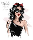 Hand drawn beautiful young woman in sunglasses. Stylish girl with bow on her head. Fashion woman look. Sketch.