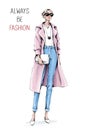 Hand drawn beautiful young woman wearing coat and jeans. Stylish girl in sunglasses holding white bag. Fashion woman look. Sketch. Royalty Free Stock Photo
