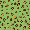 Hand-drawn brown and orange animalistic, brindle seamless pattern on green pistachio background. Print, packaging, passport, stati