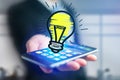 Hand drawn bulb lamp icon going out a smartphone interface of a Royalty Free Stock Photo