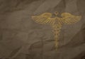 Hand drawn Caduceus on wrapping recycle paper background Royalty Free Stock Photo