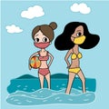 Trikini girl friends in bikini and face mask enjoy themselves on the beach in sunny day