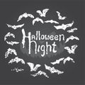 Hand drawn chalk lettering on chalkboard. Happy halloween postcard with round bat frame. Royalty Free Stock Photo