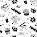 Hand drawn cinema seamless pattern with movie camera, clapper board, cinema reel and tape, popcorn in striped box, film Royalty Free Stock Photo