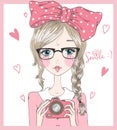 Hand drawn cute beautiful girl in glasses with pigtails and camera in her hands.