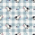 Hand drawn dairy cute cow and milk carton seamless vector pattern. Kawaii horned livestock mammal. Domesticated cattle on blue