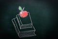 Hand Drawn Doodle Illustration with Chalk on Blackboard of Stack Pile of Books Red Glossy Apple on Top. Back to School Education Royalty Free Stock Photo