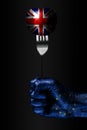 A hand with a drawn EU flag holds a fork, on which is a ball with a drawn Great Britain flag, a sign of influence, pressure, grip