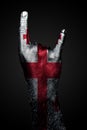 A Hand With A Drawn Georgia Flag Shows A Goat Sign, A Symbol Of Mainstream, Metal And Rock Music, On A Dark Background