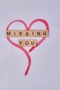 Hand drawn heart and missing you text on wooden cubes. Royalty Free Stock Photo