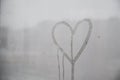 Hand drawn heart on wet window for Valentine's Day Royalty Free Stock Photo