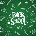 Hand drawn lettering of Back to School and doodles supplies on blackboard background Royalty Free Stock Photo