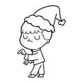 hand drawn line drawing of a grumpy boy wearing santa hat