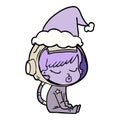 hand drawn line drawing of a pretty astronaut girl sitting waiting wearing santa hat Royalty Free Stock Photo