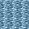 Hand drawn marine seamless pattern a group of anchovy fish on light blue background. Royalty Free Stock Photo