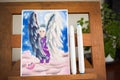 Hand drawn marker art on paper depictung female bird angel with face of a sad woman on a pink cloud. Drawing picture at