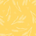 Hand drawn pattern of wheat ears and seeds on a vibrant yellow background Royalty Free Stock Photo