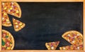 Hand drawn pizzas on a black chalk board