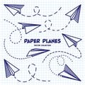 Hand drawn planes on checkered paper sheet. School notebook for drawing. Doodle airplane, dotted route line. Aircraft