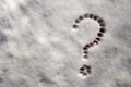 Hand drawn Question mark on snow concept for confusion, question