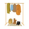 Rail and hangers for autumn and winter feminine clothing, footwear and accessories