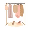 Rail and hangers for feminine pastel colored clothing, shoes and bags