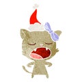 hand drawn retro cartoon of a yawning cat wearing santa hat