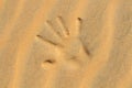 Hands drawn in the sand