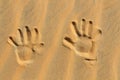 Hands drawn in the sand