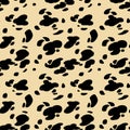 Hand drawn black and yellow seamless pattern stylized animal skin Dalmatians. Can be used for design on fabric, wallpaper