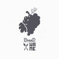 Hand drawn silhouette of grape bunch. Liquor store logo template for craft food packaging or brand identity