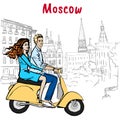Couple driving scooter in Moscow