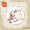 Hand drawn sketch style illustration of ripe potatoes in burlap bag