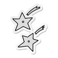 hand drawn sticker cartoon doodle of ninja throwing stars