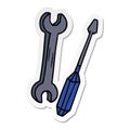 hand drawn sticker cartoon doodle of a spanner and a screwdriver