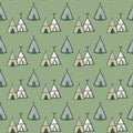 Hand drawn teepee vector seamless pattern on green background. Tribal wigwam endless wallpaper Royalty Free Stock Photo