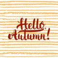 Hand drawn typography lettering phrase Hello, Autumn on the orange striped background. Fun brush ink calligraphy Royalty Free Stock Photo