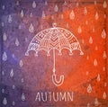 Hand-drawn umbrella and raindrops on a grunge background. Vector. Autumn theme.